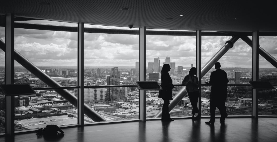 people standing inside city building