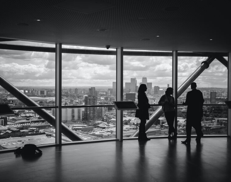 people standing inside city building