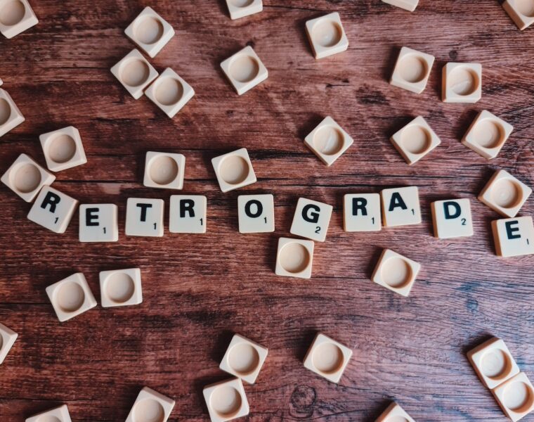 brown wooden letter blocks on brown wooden table