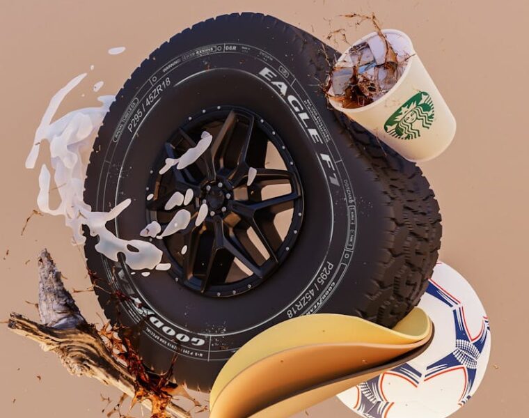 a tire and a cup of coffee sitting on top of each other