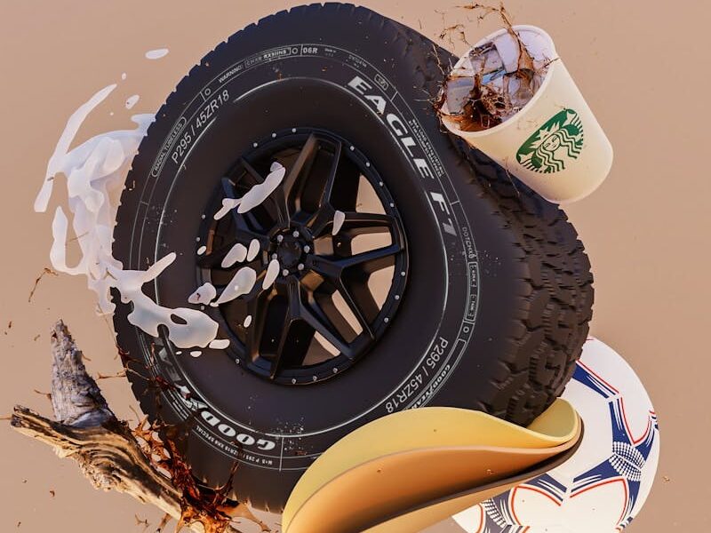 a tire and a cup of coffee sitting on top of each other